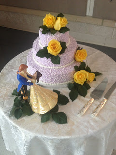 wedding cake with Beauty and Beast Cake topper